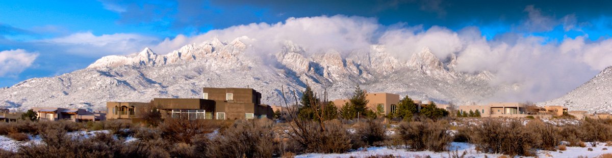Sandia Mountains with snow behind Rio Rancho homes